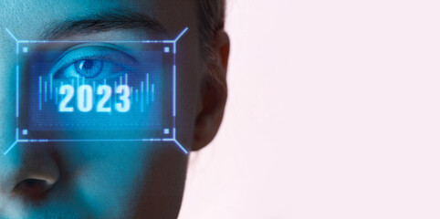 Close up view of blue eye with futuristic holographic interface to display data. Portrait of beautiful young woman, half of face. Augmented reality, future technology, 2023 concept.