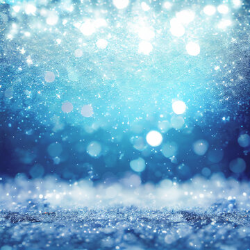 Christmas and winter holidays background with blue bokeh lights and snow.