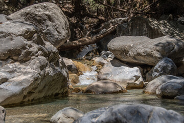 Naklejka na ściany i meble clear water flows through the Samaria Gorge on Crete