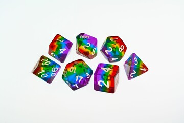 Rainbow dice illustrating the concept of LGBTQ representation and inclusion in tabletop RPG gaming