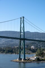 Aerial view of Lions Gate Bridge on blue sky background in Vancouver, Canada