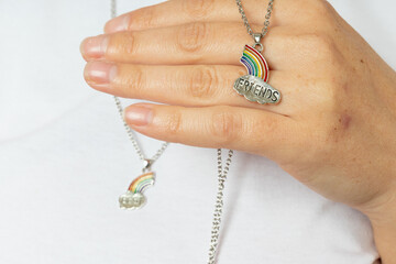 a woman holds in her hand one of the pendants of the best friends set. friendship proposal