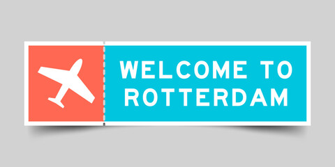 Orange and blue color ticket with plane icon and word welcome to rotterdam on gray background