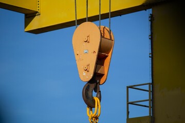 gantry crane with hook against blue sky