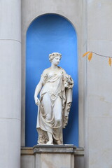 Amsterdam Historic Canal House Garden Statue of Goddess Flora in a Blue Niche with Yellow Autumn...
