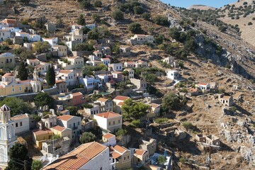 Naklejka premium Aerial view of buildings in Symi village on Symi island, Greece