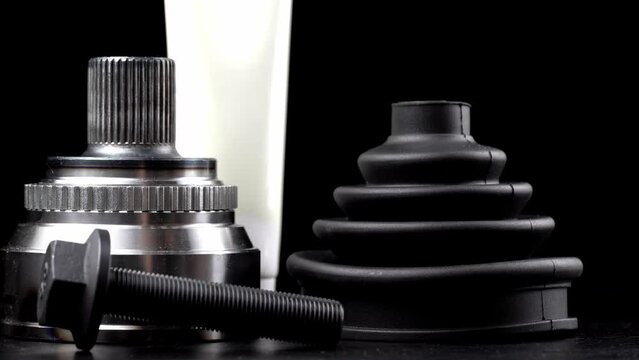 Car CV joint. Drive shaft connection on black background. New constant velocity joints. New automotive CV joints. Quality spare parts for car service or maintenance. Auto parts store. kit with anther