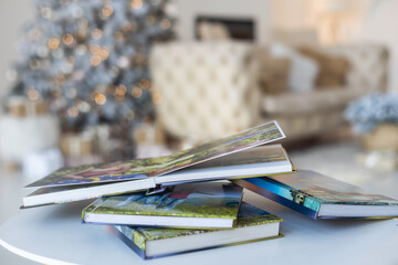 a photo album near the Christmas tree as a gift