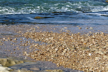The stones lie on the shores of the Mediterranean Sea.