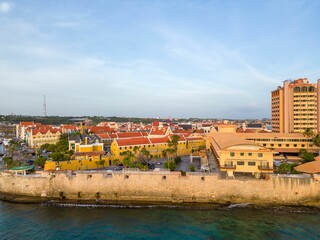 Willemstad city and the ocean during the sunset under a blue sky