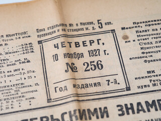 Close-up shot of a first page of an old soviet newspaper Trud (Labor) with issue date - November 10, 1927. - obrazy, fototapety, plakaty