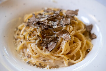 Black truffle spaghetti served on plate