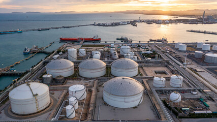Aerial view oil terminal industrial facility storage tank oil and petrochemical product for transport to further storage facility, Storage tank petroleum petrochemical refinery product at oil terminal - obrazy, fototapety, plakaty
