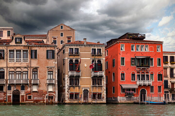 Fototapeta na wymiar Architecture of Venice, Italy. Historic houses reflects in the water, traditional architecture on Canal in Venice. 
