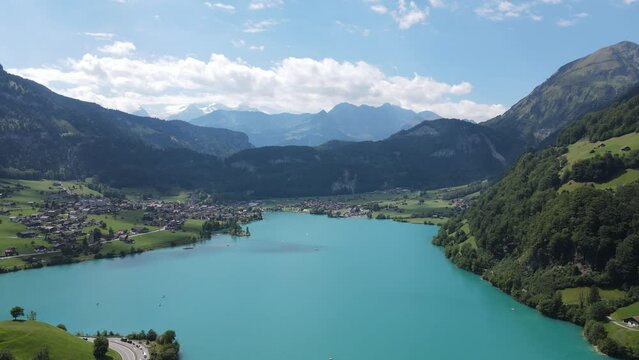 Aerial shot over Lake Lungern in Switzerland covered by rich green vegetation