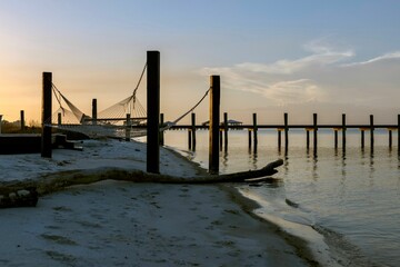 Long pier on a beach in Gulfport, Mississippi during golden hour