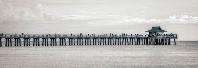 Panoramic shot of Naples Florida Fishing Pier, Gulf of Mexico, black and white photography