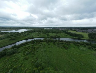Aerial view of a meander in the River Mersey with Woolston Eyes  in the background, England, UK