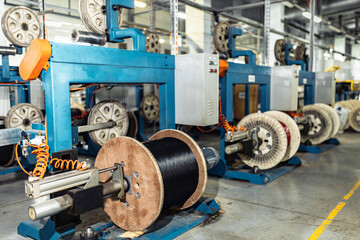 production of glass fiber fiber optic cable in the factory, Internet telecommunications wires in coils.