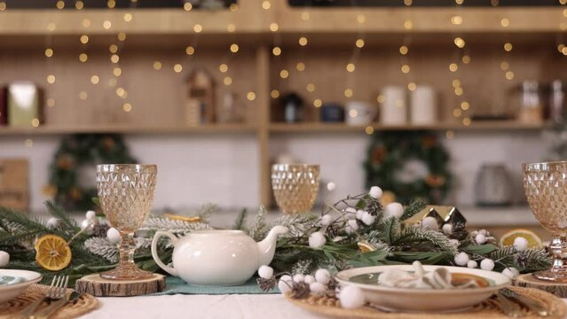 christmas table, christmas deck, festive dinner, table setting has Christmas decorations in the living room, a blurred bokeh on the new year's deck table, a rustic vintage Xmas background