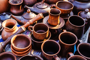 Ceramics of different shapes and sizes on the counter in the store. Pottery made in retro style. Close-up