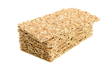 Stack of whole grain dry crispy bread with sesame isolated on a transparent background in close-up