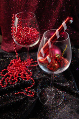 two glasses with red Christmas decorations