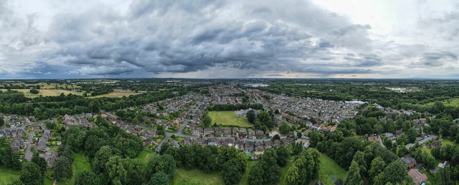 Fototapeta Panoramic shot of the Thelwall neighborhood of Warrington in England on a gloomy stormy day