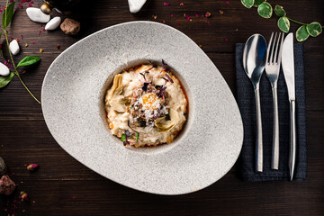 Italian dish of risotto with artichokes, parmesan top view
