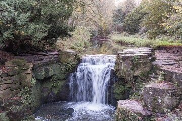 Landscape shot of a waterfall at Jesmond Dene, Newcastle upon Tyne, UK
