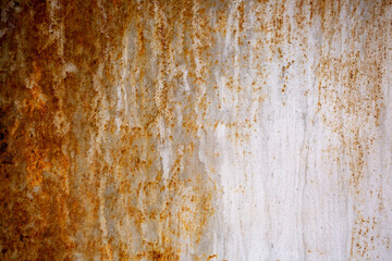 Fototapeta premium Texture of rusty iron, cracked paint on an old metal surface. Sheet of rusty metal with cracked and peeling paint, background for design with copy space.