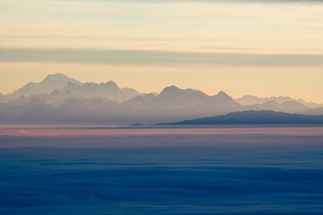 Beautiful soft sunset over the rocky mountains in the background