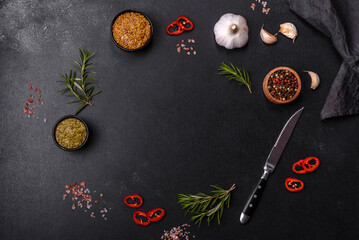 Ingredients for cooking at home: pepper, salt, rosemary, spices and herbs