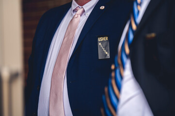 Closeup shot of an usher in a wedding