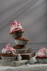 Latvian holiday themed rye cupcakes with cranberry sprinkles on white door backdrop served on white rustic hand made boards 