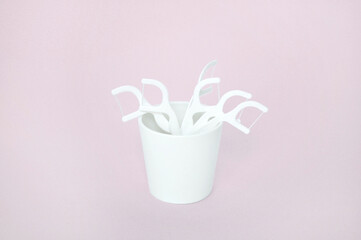 mock up of toothpicks made of dental floss and plastic