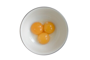 Raw eggs in a plate isolated on white background