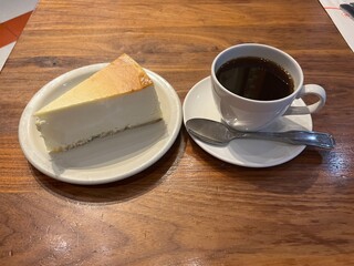 New York Cheesecake (a baked cheesecake made with cream cheese, egg yolks, sugar, lemon juice, and sour cream) and Hot Coffee