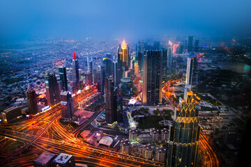  Dubai city at night, view with lit up skyscrapers and roads. UAE, 2022