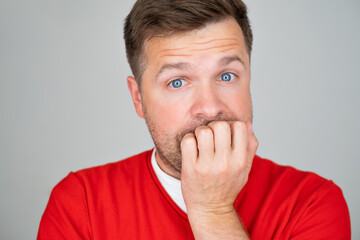 Anxious stressed young man looking at camera. He has paranoia or mental problems