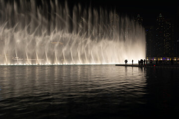 Dubai dancing fountain and people enjoying the show