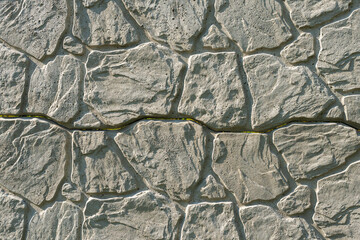 Concrete decorative fence from panels. A panel fence with a natural stone-like texture. Solid...