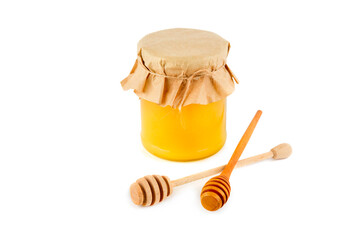 Honey pot and dipper isolated on white background.