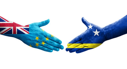 Handshake between Tuvalu and Curacao flags painted on hands, isolated transparent image.