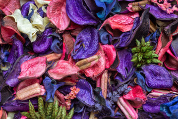 A mix of dry flowers, leaves, petals, and other plant parts. Potpourri background