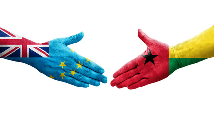 Handshake between Tuvalu and Guinea Bissau flags painted on hands, isolated transparent image.