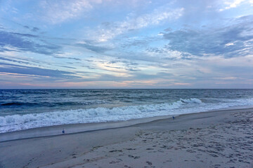 Jones Beach State Park, New York: Sunset on the shore at Jones Beach. - obrazy, fototapety, plakaty