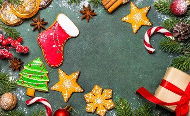 Christmas gingerbread with spices and decorations on table. Christmas baking. Top view with copy space.