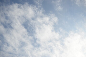 white cirrus clouds against the blue sky, white clouds against the blue sky before the rain in Ukraine