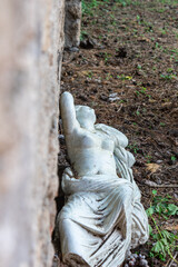 Obraz premium A lying statue of a goddess. A monument of Diana or Venus. The fallen woman made of stone. 